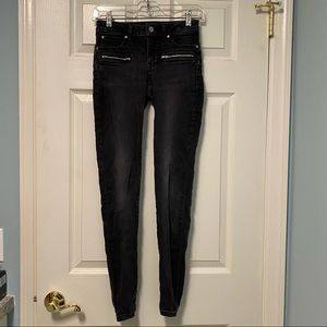 Jennifer Lopez faded black jeans with front faux zippered pockets